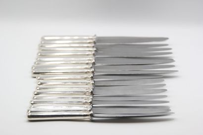 Double set of knives with silver handles...
