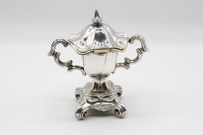 Mustard pot in silver resting on a quadripod...