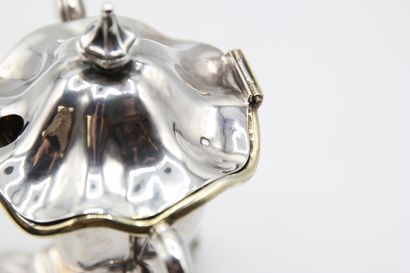 Mustard pot in silver resting on a quadripod...