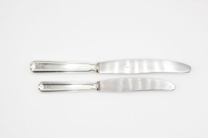 Double set of knives with silver handles...