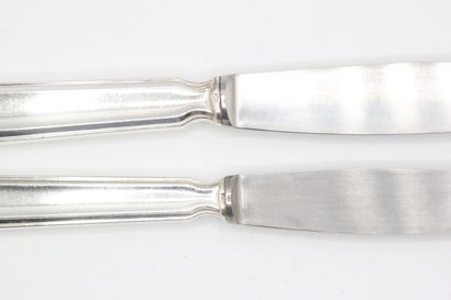 Double set of knives with silver handles...