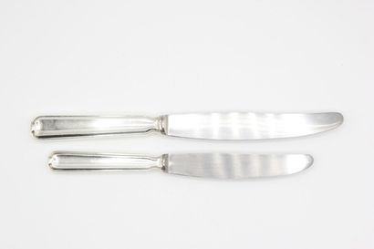 Double set of knives with silver handles...