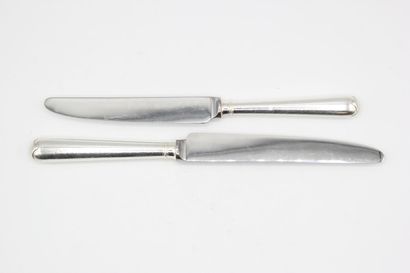 Double set of knives with silver handles...