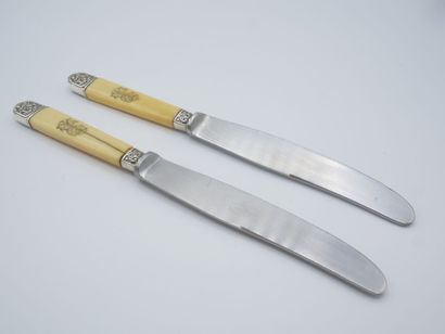 Double set of knives with figured handles....