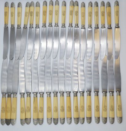 Double set of knives with figured handles....