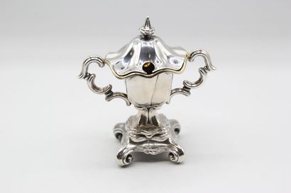 Mustard pot in silver resting on a quadripod...