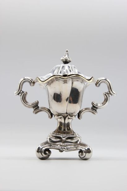 Mustard pot in silver resting on a quadripod...