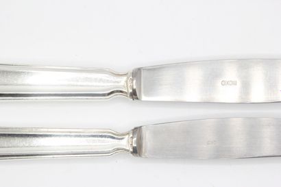 Double set of knives with silver handles...