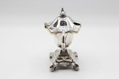 Mustard pot in silver resting on a quadripod...