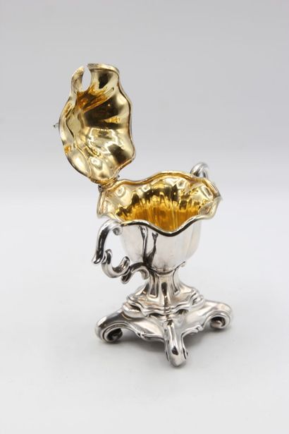 Mustard pot in silver resting on a quadripod...