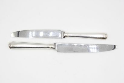 Double set of knives with silver handles...