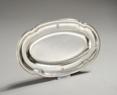 Silver serving dish decorated with nets and...