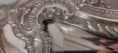 Glass of Louis XV style.

The silver frame...