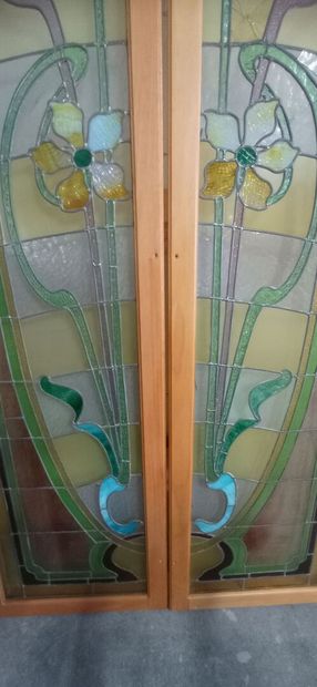 Two pair of stained glass windows in polychrome...