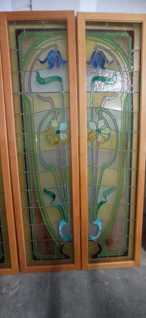 Two pair of stained glass windows in polychrome...