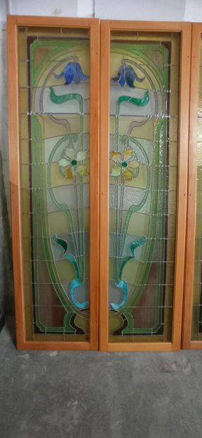 Two pair of stained glass windows in polychrome...