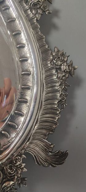 Glass of Louis XV style.

The silver frame...