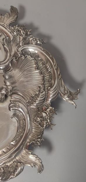 Glass of Louis XV style.

The silver frame...