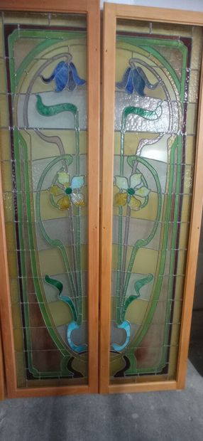 Two pair of stained glass windows in polychrome...