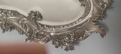 Glass of Louis XV style.

The silver frame...