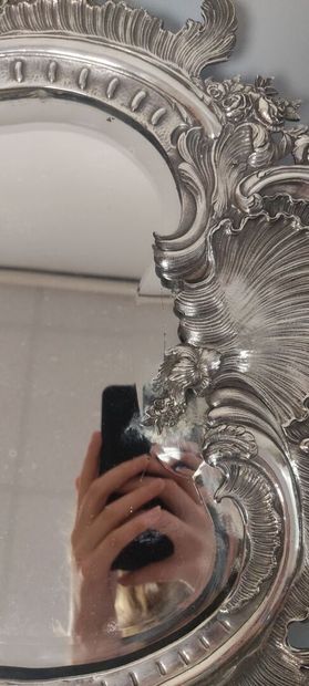 Glass of Louis XV style.

The silver frame...