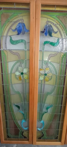 Two pair of stained glass windows in polychrome...