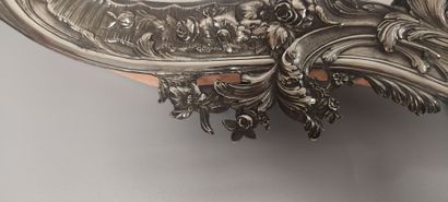 Glass of Louis XV style.

The silver frame...