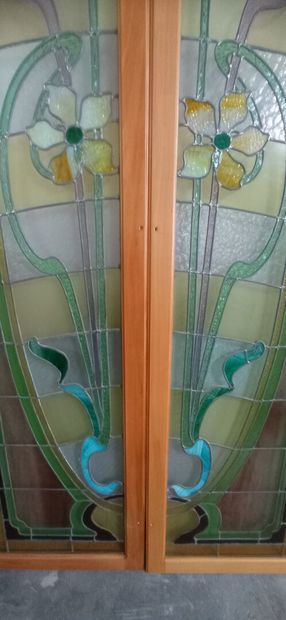 Two pair of stained glass windows in polychrome...