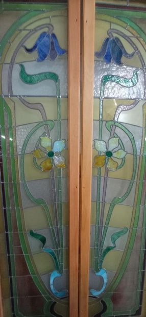 Two pair of stained glass windows in polychrome...