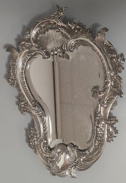 Glass of Louis XV style.

The silver frame...