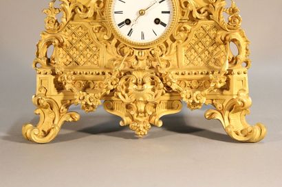 Clock in gilded and chased bronze.

The upper...