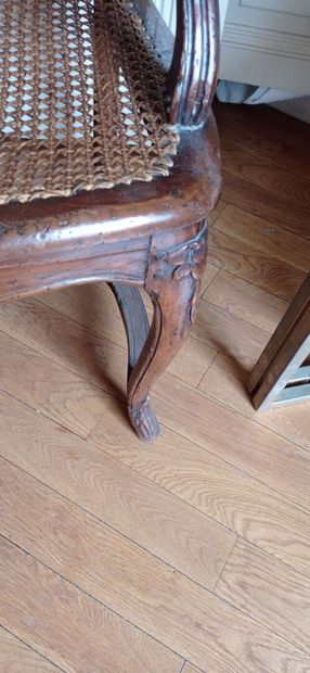 Armchair in natural wood molded and carved...