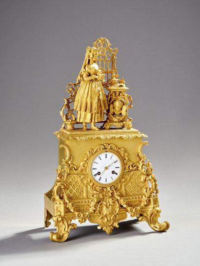 Clock in gilded and chased bronze.

The upper...