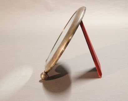 Modernist circular mirror in chromed metal.

Pose...