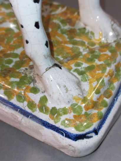 Pair of seated dalmatians in polychrome earthenware.

Rectangular...
