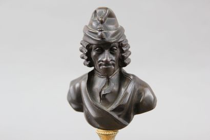 Pair of patinated bronze desk busts representing...