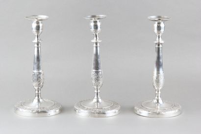Suite of three candlesticks in silver plated...