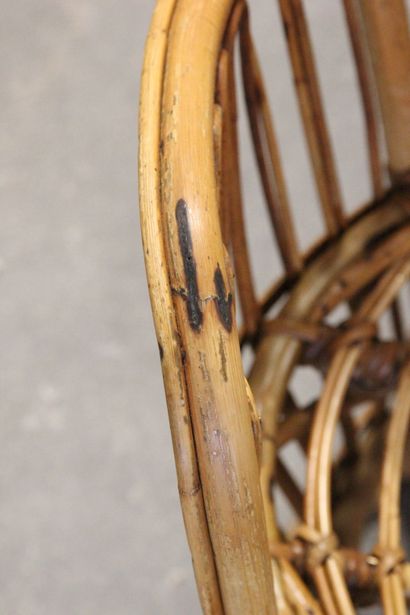 Pair of rattan armchairs.

The openwork back.

Circular...