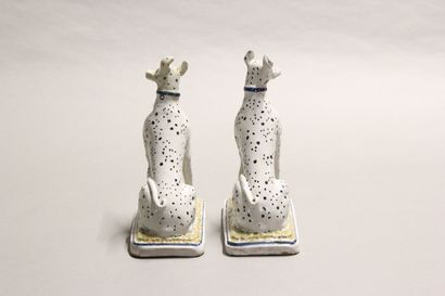 Pair of seated dalmatians in polychrome earthenware.

Rectangular...