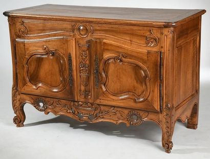 Walnut buffet molded and carved.

Opens to...