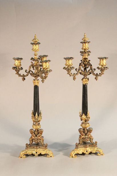 Pair of bronze and black marble candlesticks...