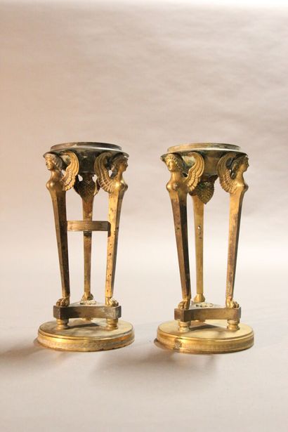 
Pair of gilt bronze cups supported by sphinxes...