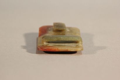 CHINA

Rust and spinach jade belt buckle.

Incised...