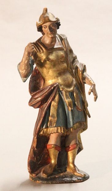 Antique soldier in armor.

Subject in polychromed...