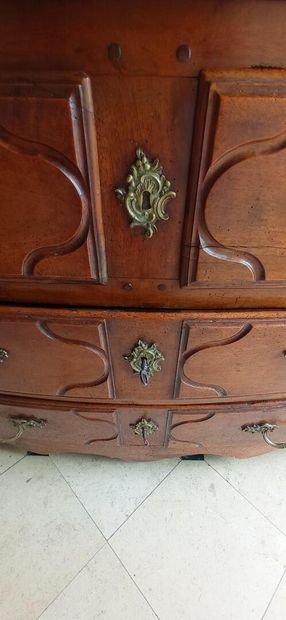 Molded walnut chest of drawers of slightly...
