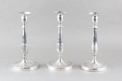 Suite of three candlesticks in silver plated...