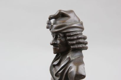 Pair of patinated bronze desk busts representing...