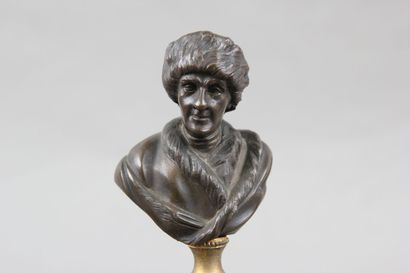 Pair of patinated bronze desk busts representing...