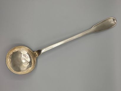 Silver ladle decorated with nets.

Dish of...