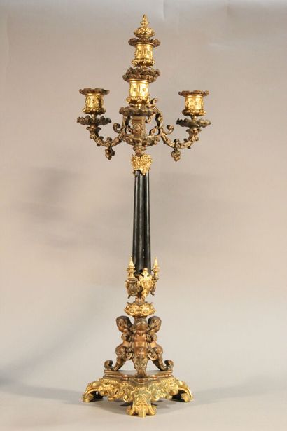 Pair of bronze and black marble candlesticks...